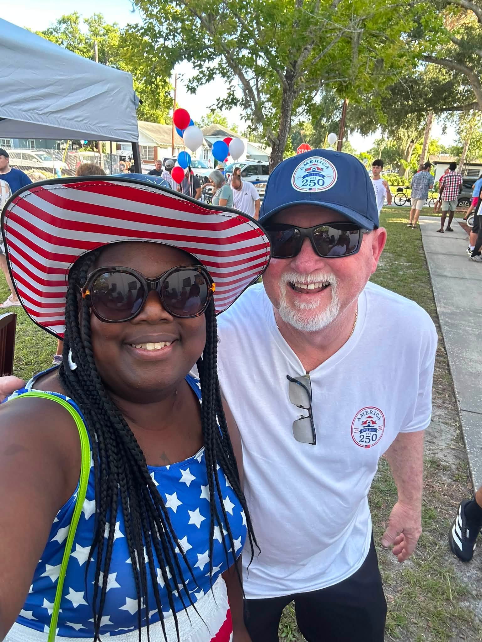 Two East Winter Garden neighbors smiling together at a community gathering