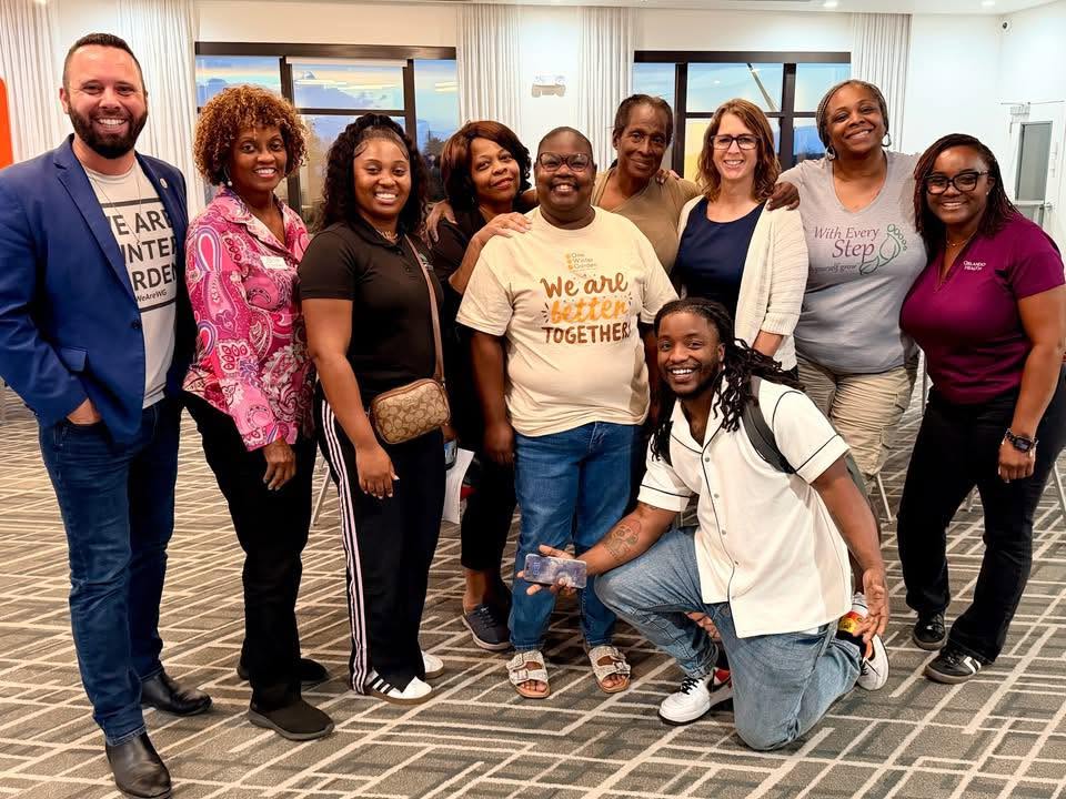 Austin Arthur with one Winter Garden board and community members together