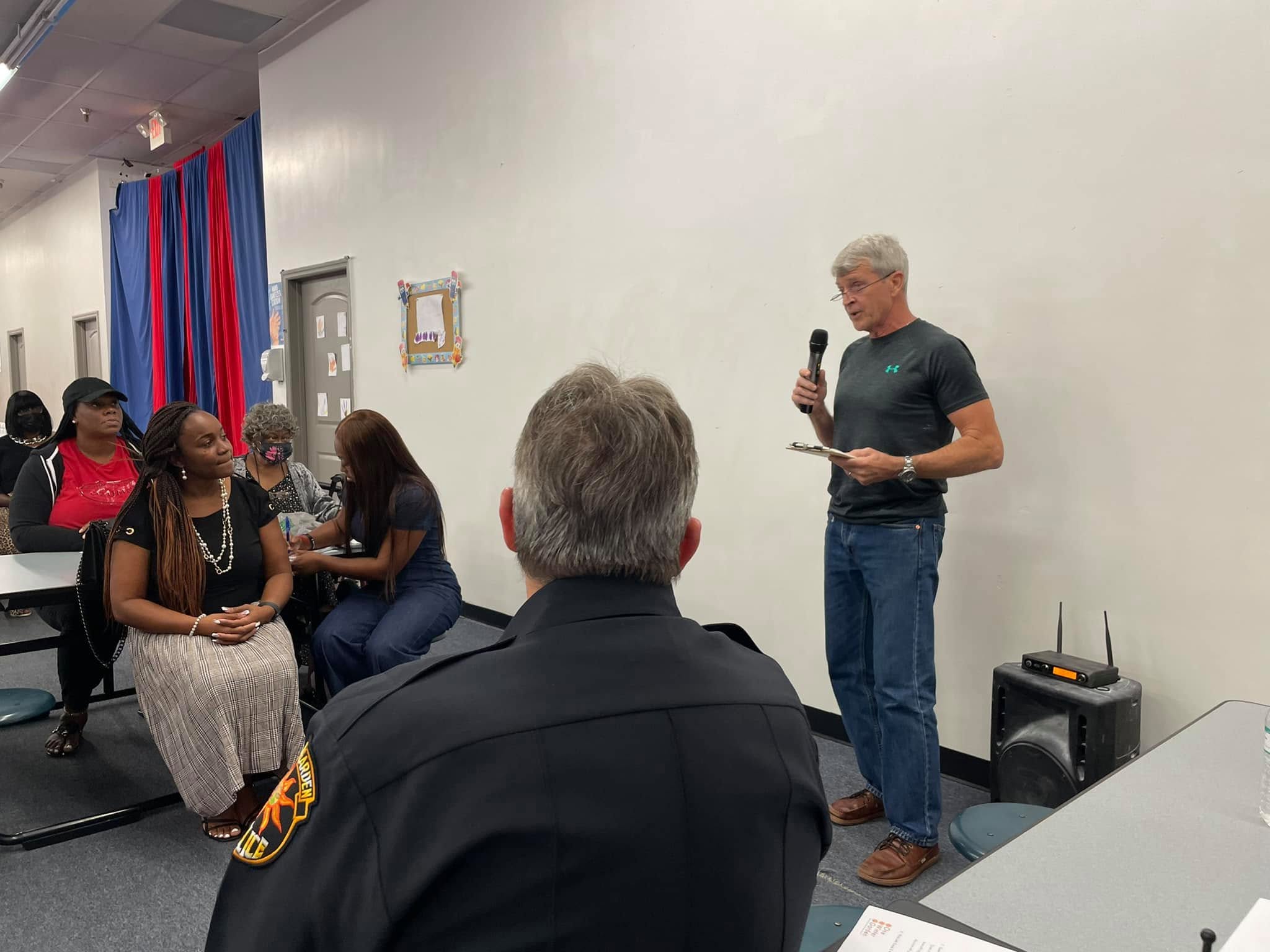 A guest speaker addressing One Winter Garden neighbors